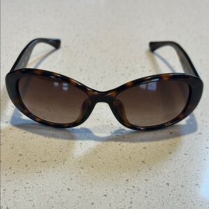 Coach Tortoise Shell Sunglasses some where